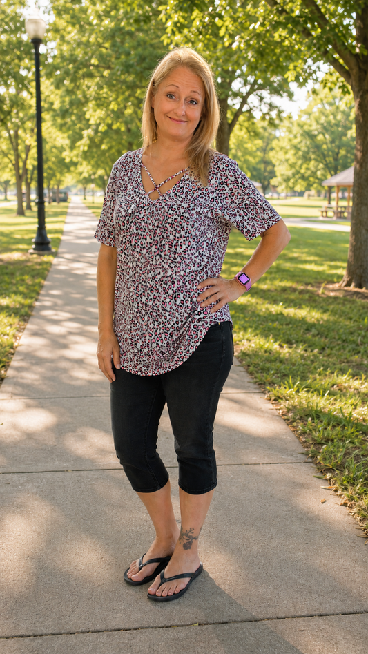 SHORT SLEEVE CRISS-CROSS VNECK ANIMAL PRINT BABYDOLL TOP